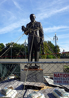 Cory Doctorow, Roped-up Satchmo statue, Louis Armstrong Park, New Orleans, Louisiana, 2010.  Area closed off since contractors poured pavement with bad cement and damaged the statue.