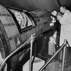 Richmond Times-Dispatch, Ralph Rogers peering into a space capsule on exhibit at the Civil War Centennial Center, Richmond, Virginia, 1963.  Courtesy of the Valentine Richmond History Center.