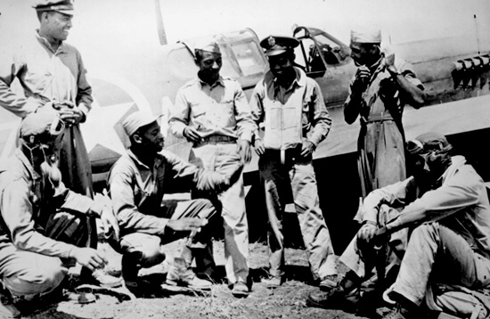 Photographer unknown, Tuskegee Airmen gathered at a U.S. base after a mission in the Mediterranean theater, February 1944. Courtesy of the United States National Archives and Records Administration. Photographer unknown, Tuskegee Airmen gathered at a U.S. base after a mission in the Mediterranean theater, February 1944. Courtesy of the United States National Archives and Records Administration.