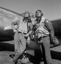 Toni Frissell, Col. Benjamin O. Davis, full-length portrait, and Edward C. Gleed, wearing flight gear, standing next to airplane, and looking upward, at air base at Ramitelli, Italy, 1945. Courtesy of the Library of Congress. Toni Frissell, Col. Benjamin O. Davis, full-length portrait, and Edward C. Gleed, wearing flight gear, standing next to airplane, and looking upward, at air base at Ramitelli, Italy, 1945. Courtesy of the Library of Congress.