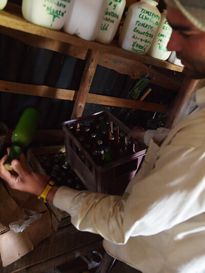 Charles D. Thompson, Jr., Royber Pimental Valido shows here some home bottled mango concentrate grown and processed on the farm. Pinar del Rio, Cuba, January 2011. Charles D. Thompson, Jr., Royber Pimental Valido shows here some home bottled mango concentrate grown and processed on the farm. Pinar del Rio, Cuba, January 2011.