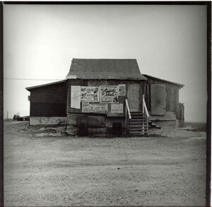 Easton Selby, The Last, near Merigold, Mississippi, Winter 2003. Contains "Not like this/"Not like that" dress code, and the now stolen "Candy Man" sign. The sign on the lower right reads "Private Club Members Only."