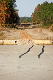 John Howard, Red ruts and black rubber, Henry County, Georgia, November 2008. John Howard, Red ruts and black rubber, Henry County, Georgia, November 2008.