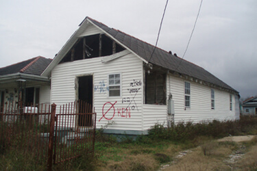 Dorothy Moye, Upper Ninth Ward house with "KEN" marking from private contractor, 2009.