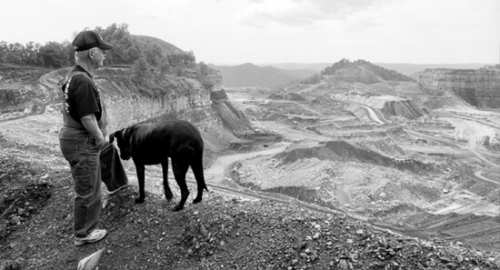 Mark Schmerling, Larry Gibson and his dog, "Dog," overlook the destruction at Kayford Mountain, Kanawha County, West Virgina, 2006. Mark Schmerling, Larry Gibson and his dog, "Dog," overlook the destruction at Kayford Mountain, Kanawha County, West Virgina, 2006.