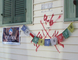Dorothy Moye, Bywater neighborhood, Tibetan prayer flags and poster with preserved code, 2009.