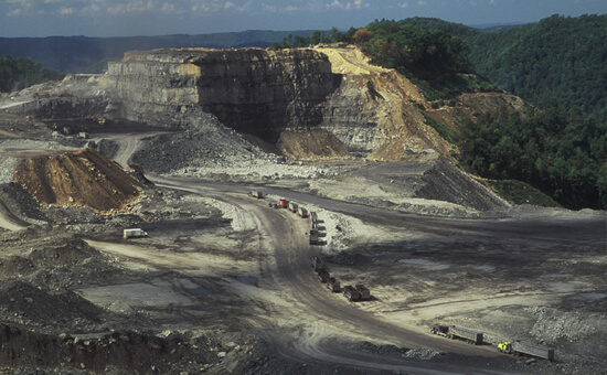 Mark Schmerling, Massive machinery is dwarfed by the size of this mountaintop removal site, Kayford Mountain, Kanawha County, West Virginia, 2006. Mark Schmerling, Massive machinery is dwarfed by the size of this mountaintop removal site, Kayford Mountain, Kanawha County, West Virginia, 2006.