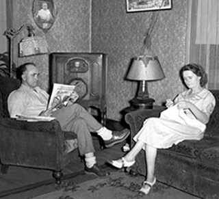 A couple listens to their radio, 1938 A couple listens to their radio, 1938