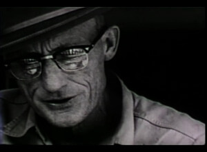 Closeup of Roscoe Holcomb playing guitar from The Highe Lonesome Sound Closeup of Roscoe Holcomb playing guitar from The Highe Lonesome Sound