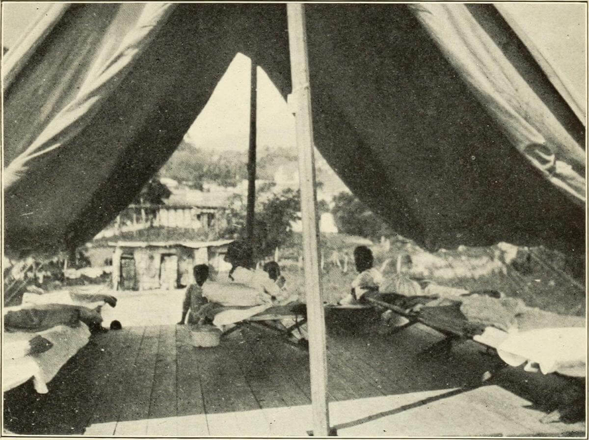 Interior of Hospital Tent, Puerto Rico, 1911. Originally published in Bailey K. Ashford and Pedro Guitérrez Igaravidez's Uncinariasis (Hookworm disease) in Porto Rico: a medical and economic problem (Washington DC: US Government Print Office, 1911). Photograph uploaded by Flickr user Internet Archive Book Images. Image is in public domain. Interior of Hospital Tent, Puerto Rico, 1911. Originally published in Bailey K. Ashford and Pedro Guitérrez Igaravidez's Uncinariasis (Hookworm disease) in Porto Rico: a medical and economic problem (Washington DC: US Government Print Office, 1911). Photograph uploaded by Flickr user Internet Archive Book Images. Image is in public domain.