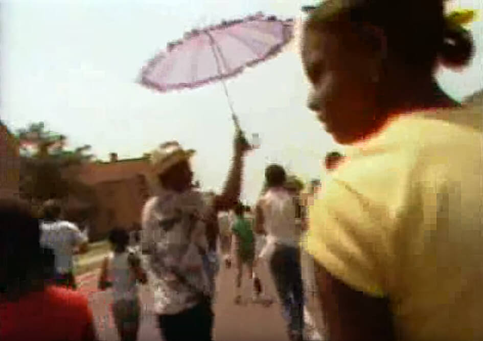 Spyboys singing at the 66th Annual Zulu Parade, New Orleans, Lousiana, May 1982. Footage by Alan Lomax and crew. Courtesy of Alan Lomax YouTube archive. Screenshot by Southern Spaces.