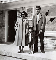 Andrew Wade and his wife and daughter stand in front of their damaged house, May 16, 1954, from the Louisville Courier-Journal. Reproduced by permission from the Wisconsin Historical Society.