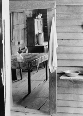 Washstand in the dog run and kitchen of Floyd Burroughs' cabin. Hale County, Alabama, 1935 or 1936. Photographic negative by Walker Evans. Courtesy of Library of Congress Prints and Photographs Division, FSA/OWI Black-and-White Negatives Collection, LC-USF342-008133.