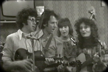 The Strange Creek Singers perform at Onllwyn Miners' Welfare Hall in Onllywyn, South Wales, 1976. Video still from Keep Your Eye upon the Scale, by Tom Hansell, Patricia Beaver, and Angela Wiley. The Strange Creek Singers perform at Onllwyn Miners' Welfare Hall in Onllywyn, South Wales, 1976. Video still from Keep Your Eye upon the Scale, by Tom Hansell, Patricia Beaver, and Angela Wiley.