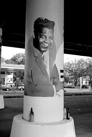 Fats Domino under the freeway, Claiborne Avenue. New Orleans, Louisiana, 2006. Photograph by Lewis Watts. Courtesy of Lewis Watts. Fats Domino under the freeway, Claiborne Avenue. New Orleans, Louisiana, 2006. Photograph by Lewis Watts. Courtesy of Lewis Watts.