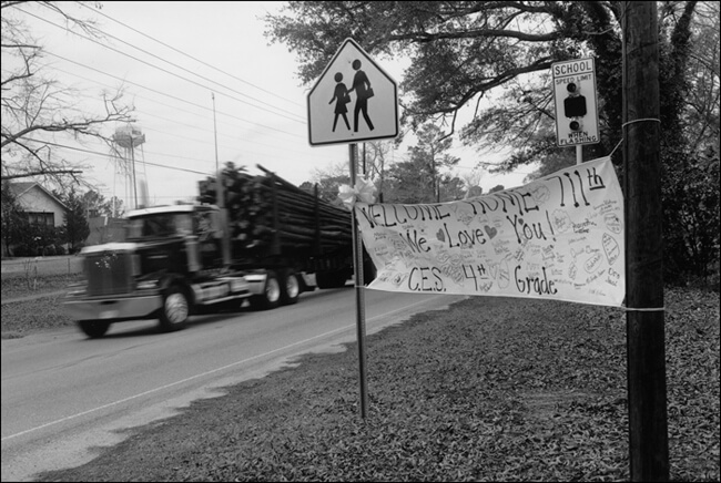 David Wharton, Welcome home and logging truck, Mississippi, 2005. David Wharton, Welcome home and logging truck, Mississippi, 2005.