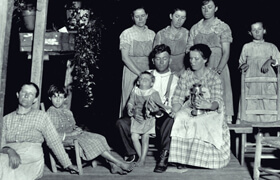 Francis Harper, Members of the Robert Allen Chesser family sing Sacred Harp on the porch, Chesser's Island, 1922.