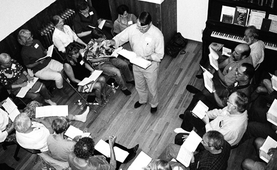 Laurie Kay Sommers, David Lee leads a singing school in a private home as part of the Rocky Mountain Sacred Harp Convention, Boulder, Colorado, September 26, 2003.