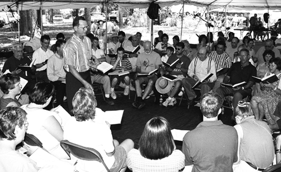 Laurie Kay Sommers, D. Johnny Lee leads at the Silas Lee Memorial Sacred Harp Sing, Florida Folk Festival, White Springs, Florida, 2000.