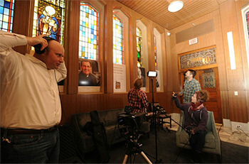 Justin Nystrom and students Kyleah Frederic, Eric Buras, and Kaleigh Macchioand prepare equipment for a recording session, Loyola University, New Orleans, Louisiana, October 29, 2012. Photograph by Harold Baquet. Courtesy of Harold Baquet and Justin Nystrom.