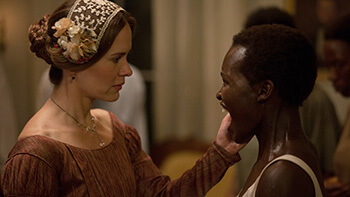 Sarah Paulson as Mistress Epps and Lupita Nyong'o as Patsey, 2013. © FoxSearchlight. Sarah Paulson as Mistress Epps and Lupita Nyong'o as Patsey, 2013. © FoxSearchlight.