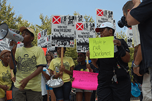 Fair Development Campaign protest of Harbor Point development, Baltimore, Maryland, July 17, 2013. Photograph by Flickr user United Workers (CC BY 2.0). Fair Development Campaign protest of Harbor Point development, Baltimore, Maryland, July 17, 2013. Photograph by Flickr user United Workers (CC BY 2.0).
