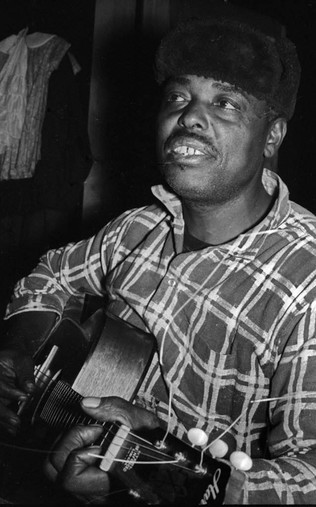 Bud Grant playing the guitar.