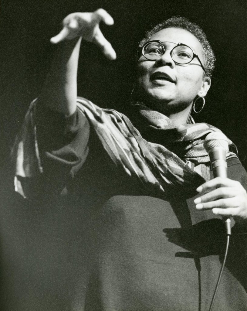 bell hooks speaking into a microphone.