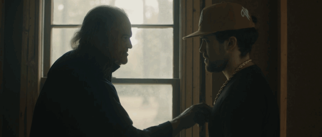 Dock emphasizing a point by pressing his fingers on Dollar's chest.